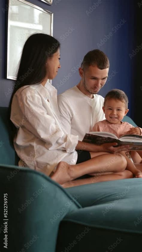 parent and child reading a book Stock Video | Adobe Stock