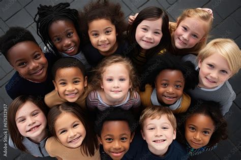Faces of children of different races and ethnicities stare into the ...