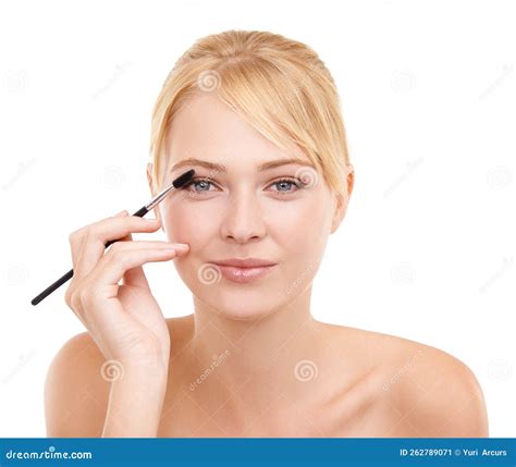 Highlighting Her Beautiful Eyes. Studio Shot of a Young Woman Applying ...