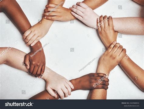 Different Cultures Holding Hands