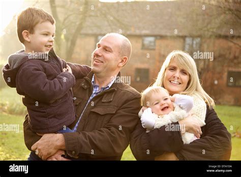 Family Of Four With Mom Dad Sister And Brother High Resolution Stock ...