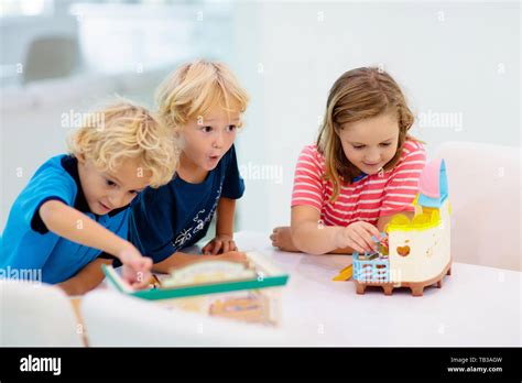 Kids play board game. Group of preschool children playing educational ...