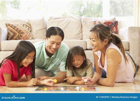 Family Playing Board Game at Home Stock Image - Image of asian, aged ...
