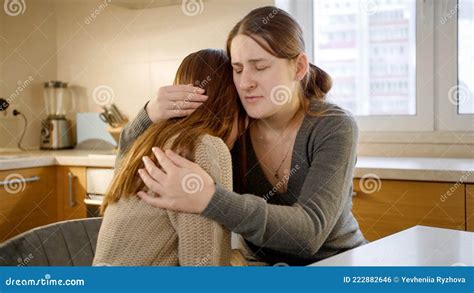 Young Mother Comforting and Consoling Her Upset Teenage Daughter ...