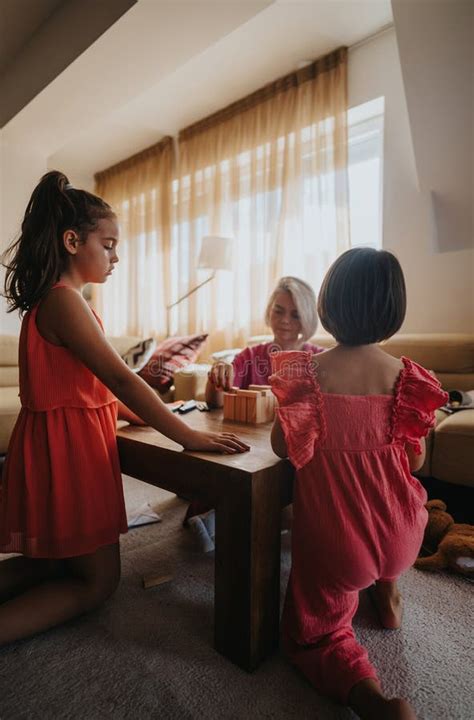 Family Bonding with Children Playing Games in Cozy Living Room Stock ...