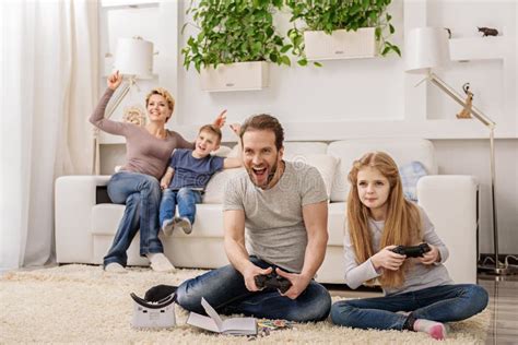 Parent and Child Playing Video Game Console Stock Image - Image of ...