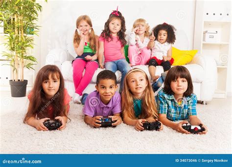 Group of Little Kids Playing Video Game Stock Photo - Image of home ...