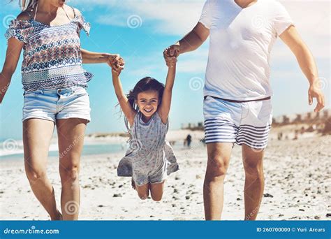 Playtime with the Parents. a Happy Young Family Enjoying Their Day at ...