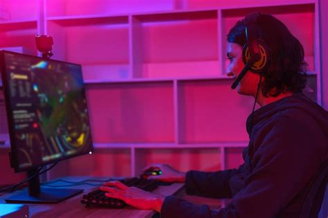 Premium Photo | Game stream concept male streamer wear headset to play ...