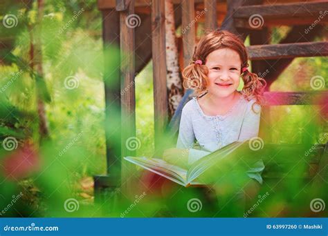 Happy Child Girl Reading Book Outdoor Stock Photo - Image of learning ...