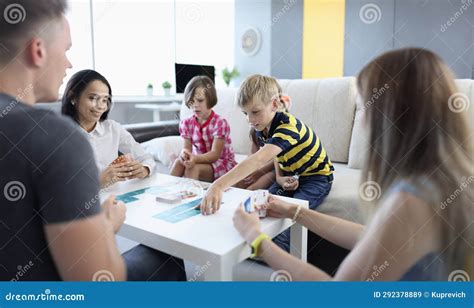 Parents and Children Play Board Game Together at Table Stock Image ...