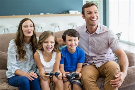 Happy Family Playing Video Games Together in Living Room Stock Image ...