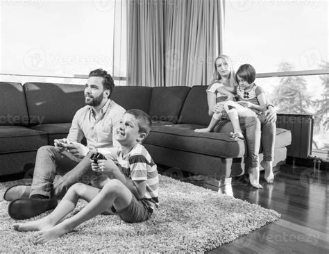 Happy family playing a video game 31032203 Stock Photo at Vecteezy