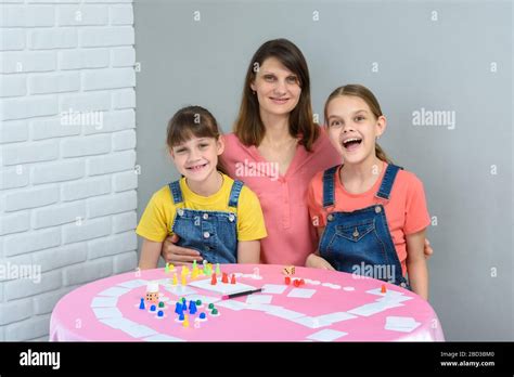 Mom and child playing cards hi-res stock photography and images - Alamy