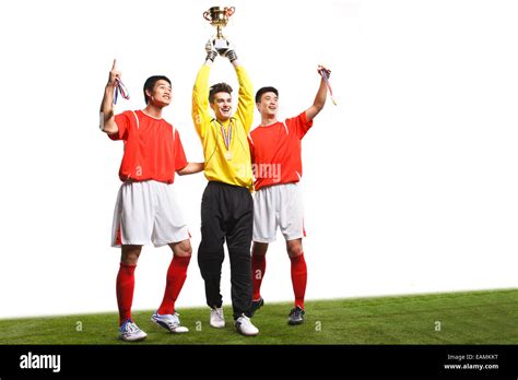 Football players celebrate success Stock Photo - Alamy