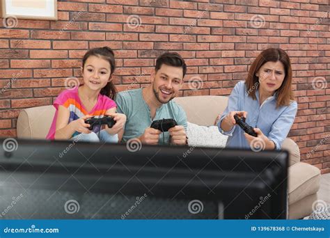 Happy Family Playing Video Games Stock Photo - Image of games, enjoying ...